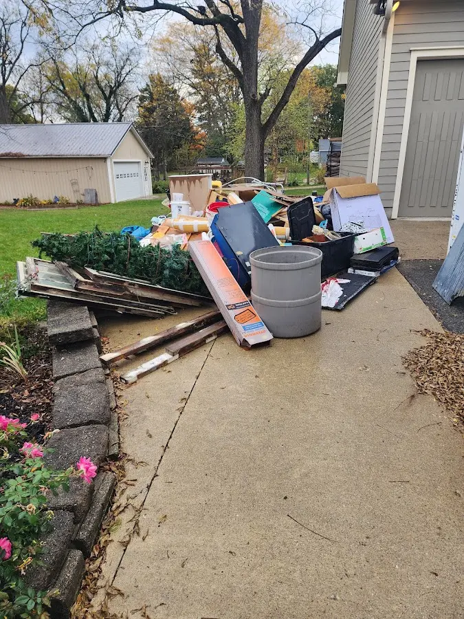 Dumpster being loaded with debris for 3 Yard Dumpster Rental in Iona
